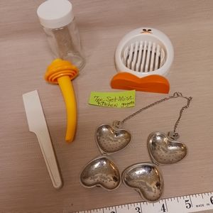 Egg slicer, yellow funnel, small spatula, heart tea infuser